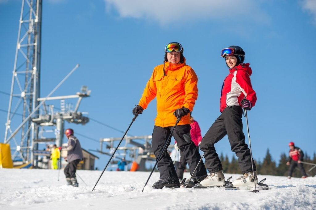 Two people skiing on a snowy slope in Breckenridge